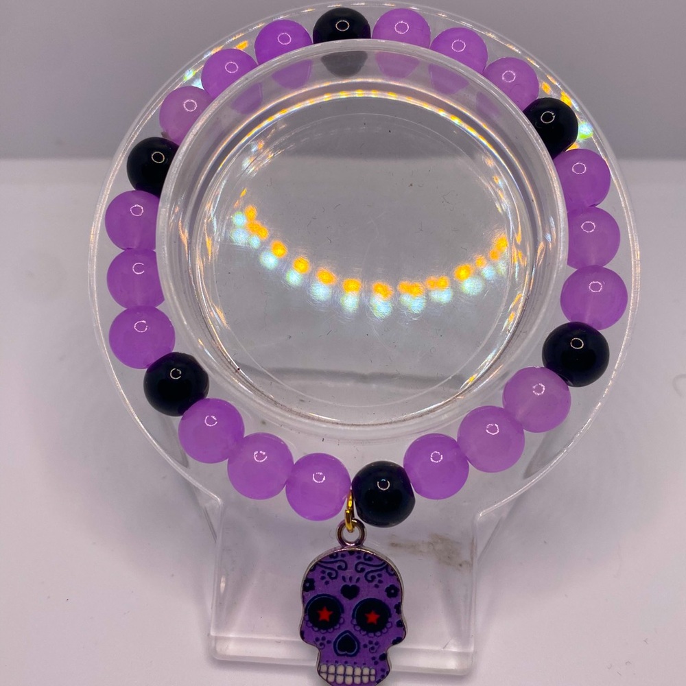 Purple and black beaded skull bracelet with a touch of goth charm